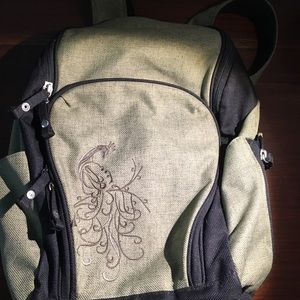 REI backpack with peacock details